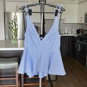 Peplum top that ties at shoulders